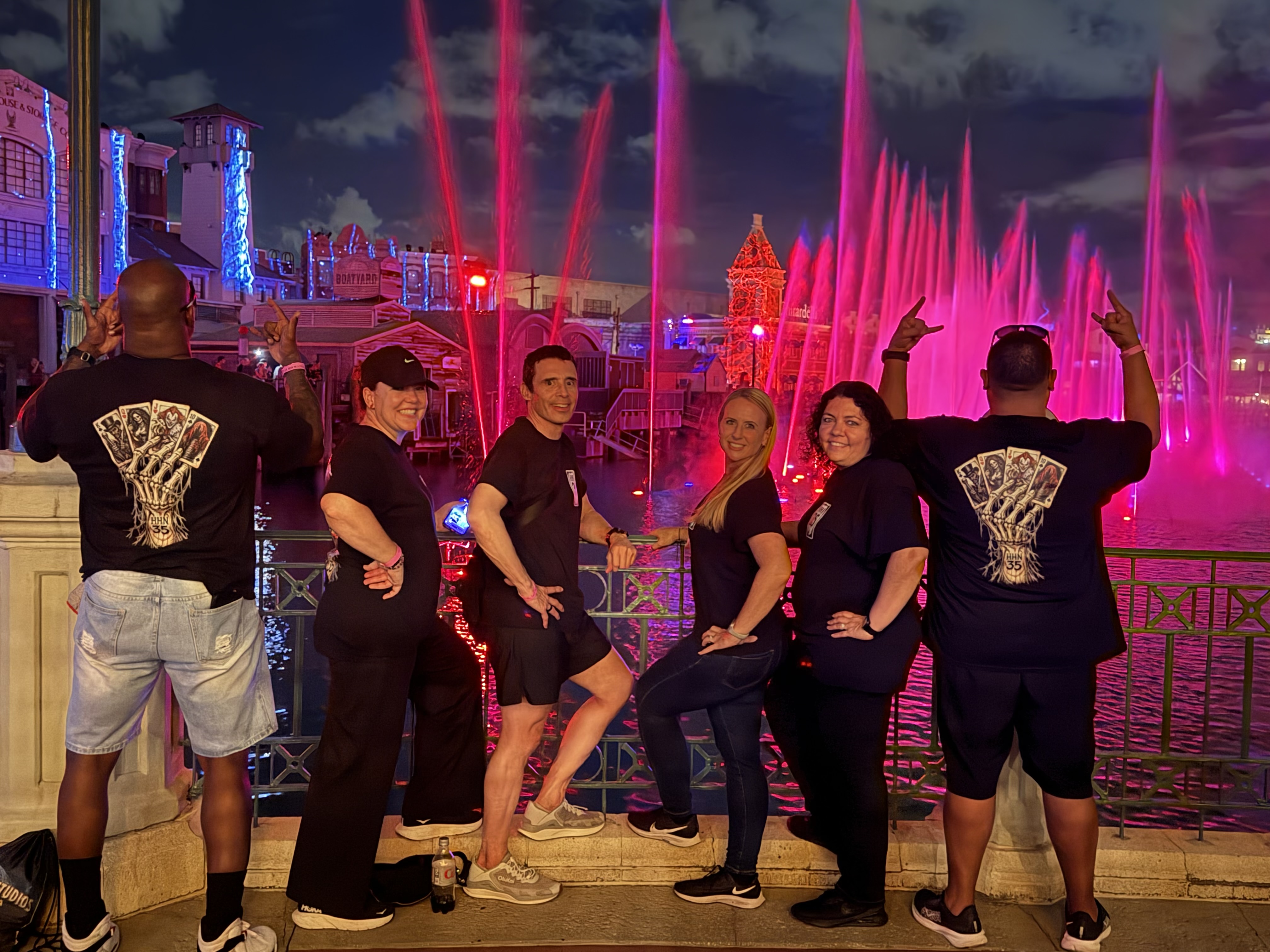 Customers wearing HHN 35 shirts at the fountains